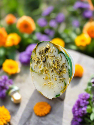 bar of soap table outside in herb and flower garden sunny day flowers herbs calendula mint lavender