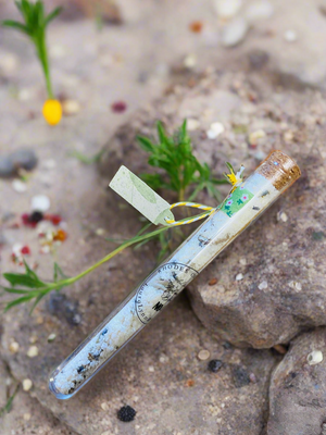 Bath salts in test tube floral background 