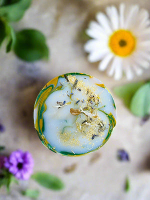 bar of soap table outside in herb and flower garden sunny day flowers herbs calendula mint lavender